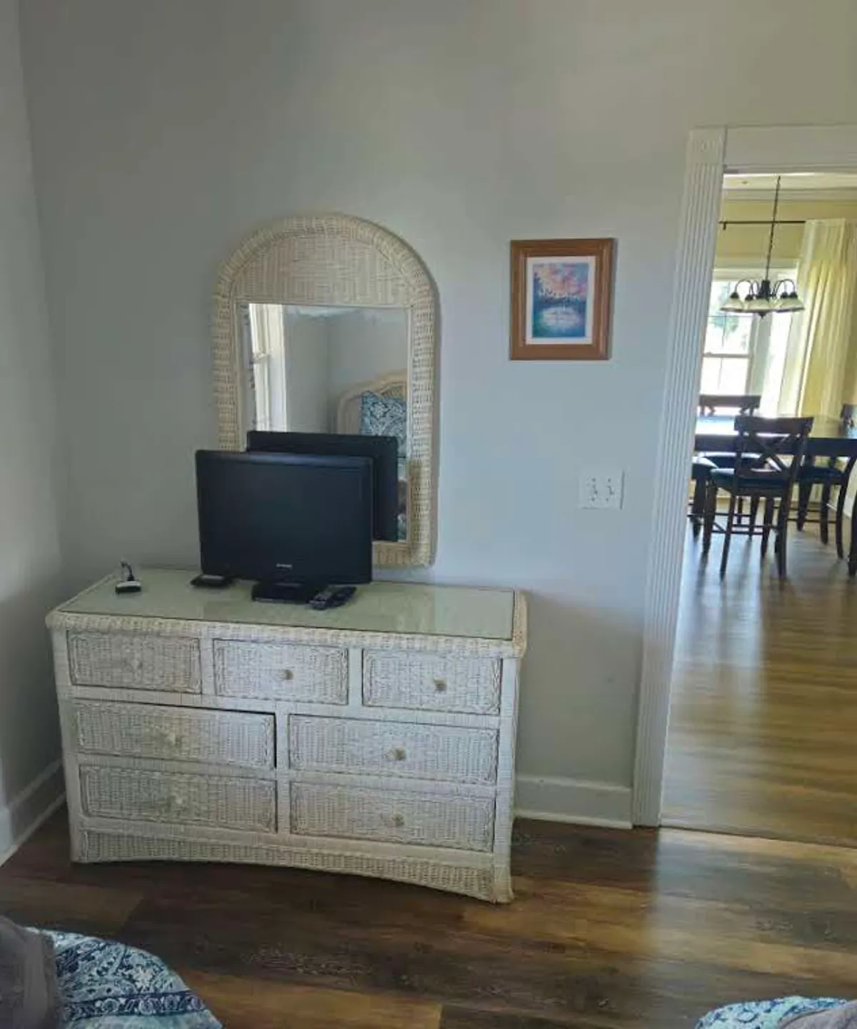 A cozy dressing area with a mirror, dressing table, and television, evoking a relaxed, casual vibe. This space is well-suited for getting ready with friends before heading out for Myrtle Beach nightlife.