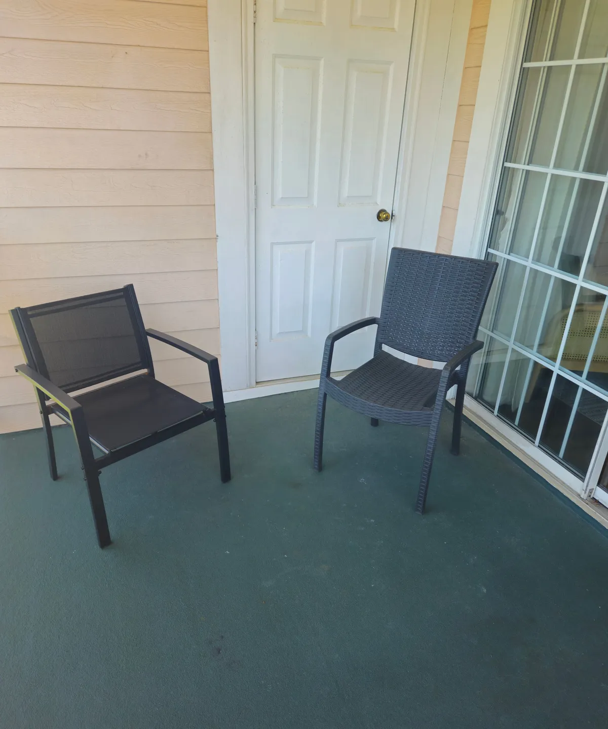 This exterior shot captures a cozy porch with two chairs facing out, suggesting a welcoming spot to soak in the view or enjoy a quiet moment after golf. The casual setting hints at personal relaxation and socializing, connecting to the idea of unwinding and sharing stories after a day on the course.